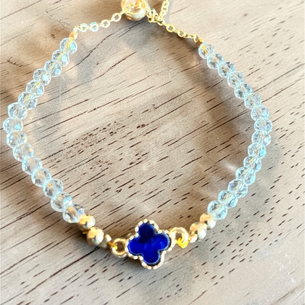 Gold Tone Clear Beaded Bracelet with Blue Clover Charm‎
